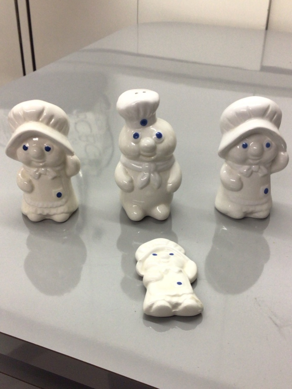 PILLSBURY DOUGH BOY 2 SALT SHAKERS AND ONE PEPPER SHAKER AND REFRIGERATOR MAGNET
